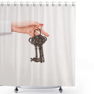Personality  Cropped Image Of Female Hand Holding Vintage Keys Isolated On White Shower Curtains