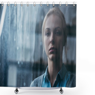 Personality  Selective Focus Of Sad Adult Woman At Home Looking At Camera Through Window With Raindrops Shower Curtains