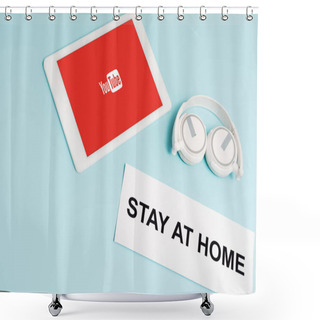 Personality  KYIV, UKRAINE - APRIL 8, 2020: Digital Tablet With Youtube App Near Headphones And Paper With Stay At Home Lettering On Blue  Shower Curtains