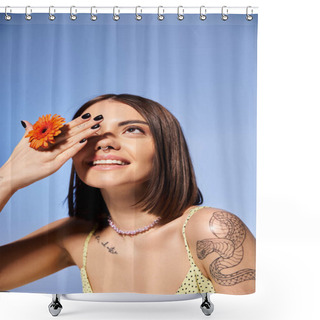 Personality  A Young Woman With Brunette Hair Delicately Holds A Blooming Flower In A Serene Studio Setting. Shower Curtains