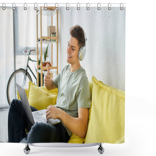 Personality  Smiling Young Man With Headphones And Laptop In Yellow Couch Liking To Online Meeting Shower Curtains