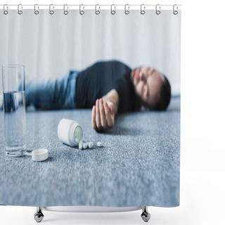 Personality  Selective Focus Of Unconscious Man Lying On Grey Floor Near Glass Of Water And Container With Pills  Shower Curtains