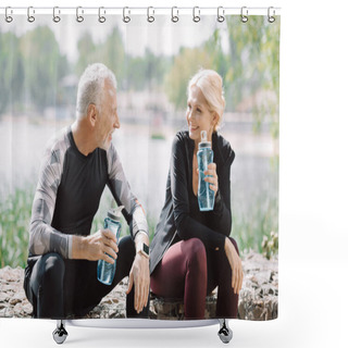 Personality  Cheerful Mature Sportsman And Sportswoman Looking At Each Other While Sitting On Parapet With Sports Bottles Shower Curtains