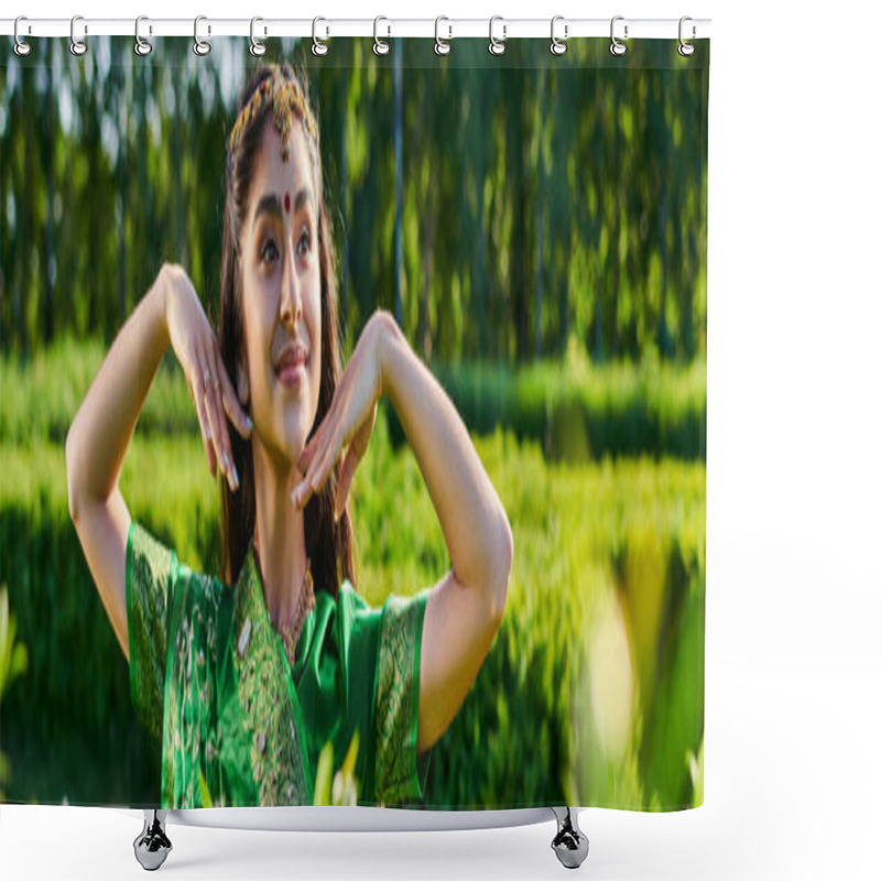 Personality  Smiling Young Indian Woman With Bindi And Sari Posing Near Plants In Park In Summer, Banner Shower Curtains