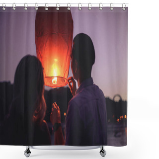 Personality  Rear View Of Young Couple Launching Sky Lantern On River Beach In Evening Shower Curtains