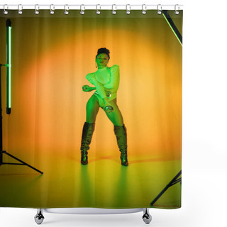 Personality  Stylish African American Woman In Neon Bodysuit And Knee Boots Holding Disco Balls Near Fluorescent Lamps On Orange Background  Shower Curtains
