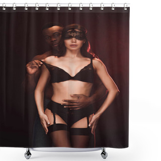 Personality  African American Man Looking At Camera And Undressing Beautiful Sexy Woman In Lace Mask On Dark Shower Curtains
