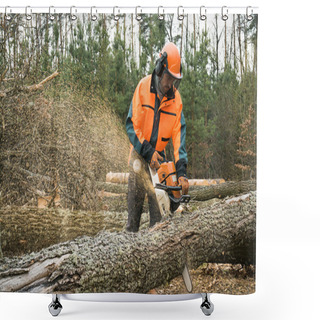 Personality  Forestry Worker With Chainsaw Is Sawing A Log. Process Of Loggin Shower Curtains