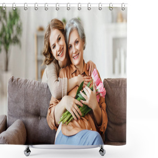 Personality  Cheerful Young Female Smiling And Embracing Happy Senior Mother With Bouquet Of Tulips In Hands While Sitting Together On Sofa In Modern Apartmen Shower Curtains