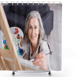 Personality  Smiling Mature Woman Holding Paintbrush And Palette While Painting With Blurred Foreground  Shower Curtains