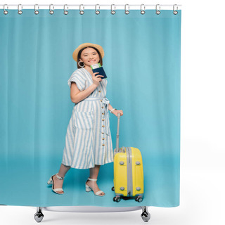 Personality  Smiling Brunette Asian Girl In Striped Dress And Straw Hat With Travel Bag And Passport With Air Ticket On Blue Background Shower Curtains
