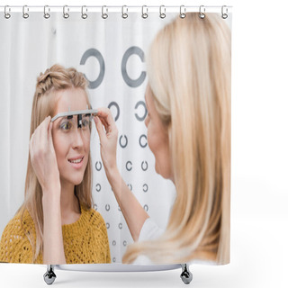 Personality  Patient And Oculist With Trial Frame And Eye Chart Behind Shower Curtains