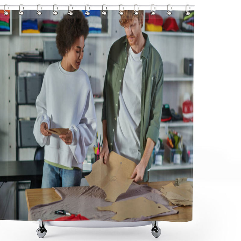 Personality  Young African American Craftswoman Holding Sewing Pattern And Standing Near Cloth On Table And Redhead Colleague In Print Studio, Collaborative Business Owners Working Together  Shower Curtains
