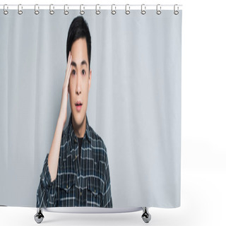 Personality  Panoramic Shot Of Young Asian Man Touching Forehead And Looking At Camera Isolated On Grey Shower Curtains