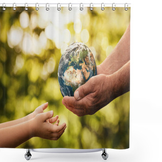 Personality  Close Up Of Senior Hands Giving Small Planet Earth To A Child Over Defocused Green Background With Copy Space  Shower Curtains