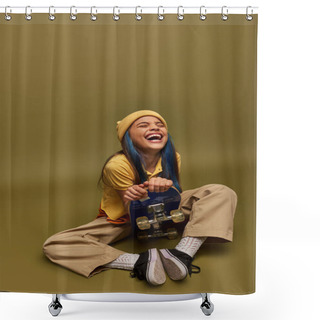 Personality  Laughing And Stylish Preadolescent Girl With Colored Hair Wearing Urban Outfit And Yellow Hat Holding Skateboard And Sitting On Khaki Background, Girl With Cool Street Style Look Shower Curtains