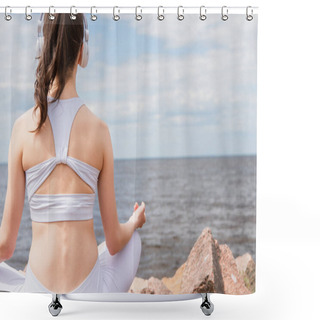 Personality  Back View Of Young Woman In Headphones And Sportswear Sitting In Lotus Pose While Meditating Near Sea  Shower Curtains