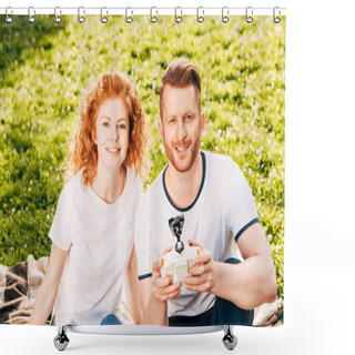 Personality  Happy Couple Playing With Drone And Smiling At Camera While Sitting On Plaid At Park Shower Curtains