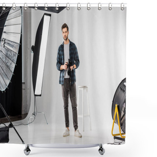 Personality  Handsome Young Photographer Holding Professional Camera And Looking At Camera In Photo Studio  Shower Curtains