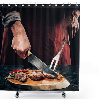 Personality  Close-up Partial View Chef In Apron With Meat Fork And Knife Slicing Gourmet Grilled Steaks With Rosemary And Chili Pepper On Wooden Board  Shower Curtains
