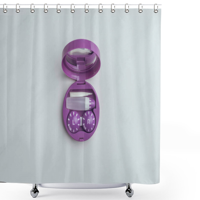 Personality  top view of purple container with contact lenses and its storage equipment on white tabletop shower curtains