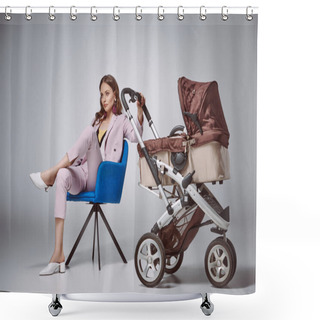 Personality  Stylish Woman Holding Baby Stroller While Sitting On Chair And Looking Away On Grey Shower Curtains