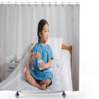 Personality  Asian Girl In Hospital Gown Looking Away While Eating Tasty Yogurt On Bed In Pediatric Clinic Shower Curtains