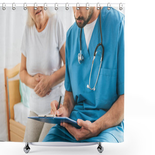 Personality  Cropped Shot Of Doctor Writing On Clipboard While Sick Senior Woman Sitting On Hospital Bed Shower Curtains