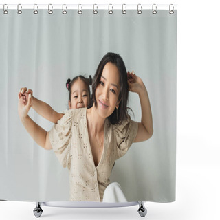Personality  Cheerful Asian Woman Holding Hands With Toddler Daughter Isolated On Gray Shower Curtains