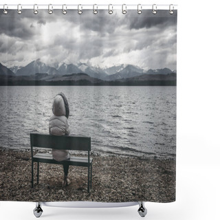 Personality  Woman In Jacket Sitting On Bench On The Shore Of The Lake. Dark Cloudy Sky With Mountains At Background Shower Curtains