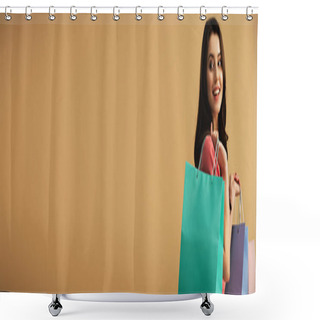 Personality  Panoramic Shot Of Smiling And Beautiful Woman Holding Shopping Bags Isolated On Beige Shower Curtains