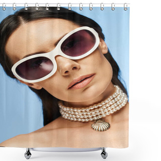 Personality  A Stylish Woman With Sunglasses And A Necklace Poses Against A Blue Background In A Studio Setting. Shower Curtains