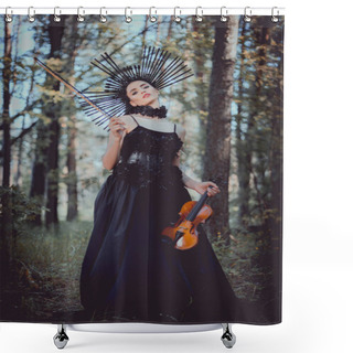 Personality  Low Angle View Of Young Woman In Witch Costume Standing On Forest Background, Holding Violin Shower Curtains
