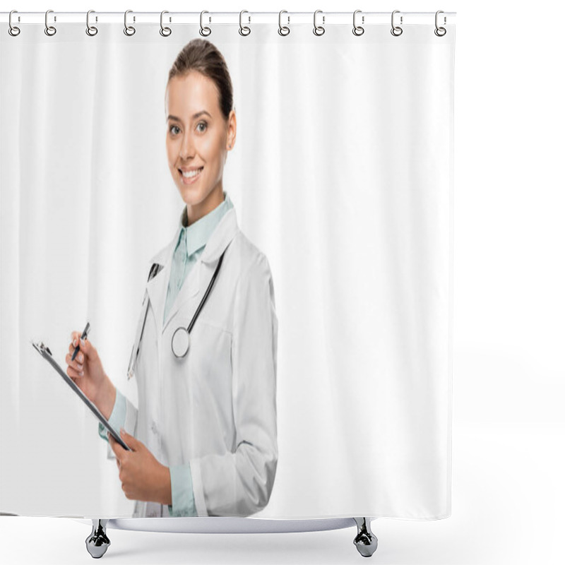 Personality  Smiling Young Female Doctor In Medical Coat Writing In Clipboard Isolated On White Shower Curtains