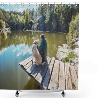 Personality  A Man With A Labrador Retriever Dog Sits On A Wooden Deck On A Beautiful Rocky Shore Of A Lake And Looks At The Water Shower Curtains
