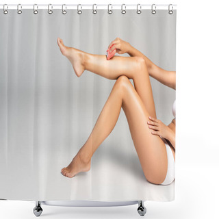 Personality  Cropped View Of Woman In White Underwear Shaving Leg With Epilator, While Sitting On Grey Shower Curtains