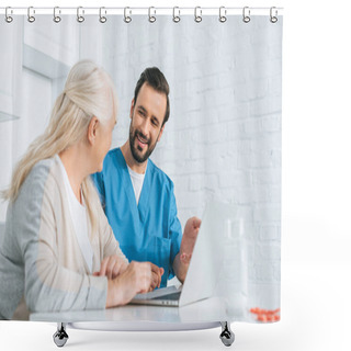 Personality  Smiling Young Social Worker Looking At Senior Woman Using Laptop  Shower Curtains