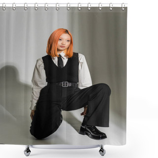 Personality  Full Length Of Youthful And Stylish Asian Woman In A White Shirt, Black Vest And Pants, With Colored Red Hair Posing And Looking Away On Grey Shaded Background, Fashion Shoot, Generation Z Shower Curtains