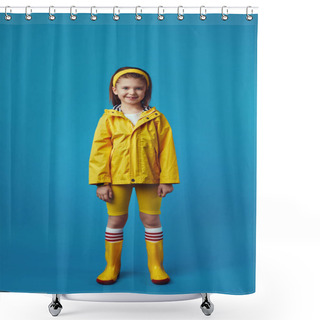 Personality  Full Body Girl In Yellow Raincoat And Boots Smiles While Standing Over Blue Shower Curtains
