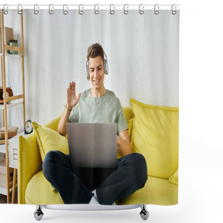 Personality  Cheerful Student With Headphones And Laptop In Yellow Couch Saying Hello To Online Meeting Shower Curtains