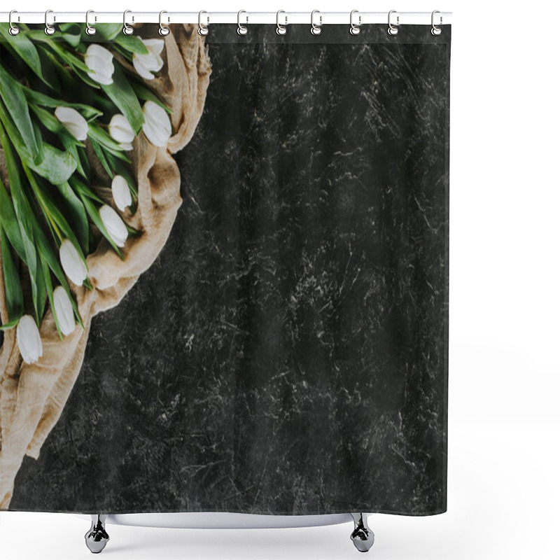 Personality  top view of white tulip flowers on tablecloth on black surface shower curtains