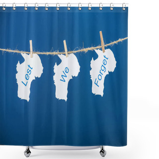 Personality  Rope, Clothespins And Papers With Lest We Forget Lettering On Blue Shower Curtains
