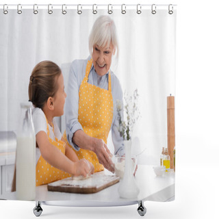 Personality  Cheerful Granny Holding Flour And Looking At Kid With Dough On Blurred Foreground In Kitchen  Shower Curtains