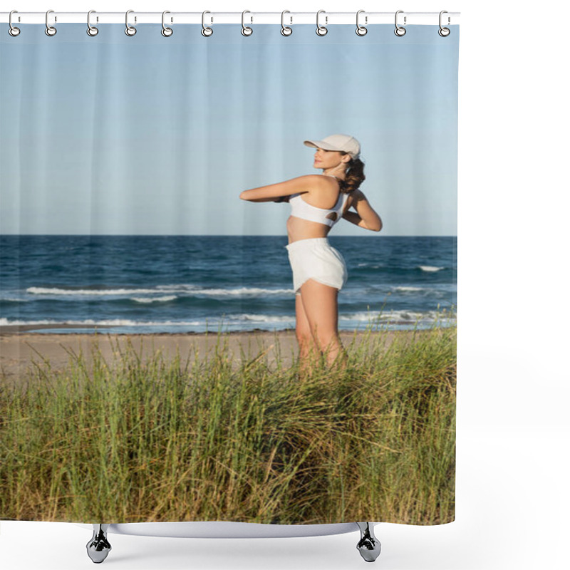 Personality  Young Fit Woman In Shorts And Sports Bra Exercising Near Blue Sea On Beach Shower Curtains