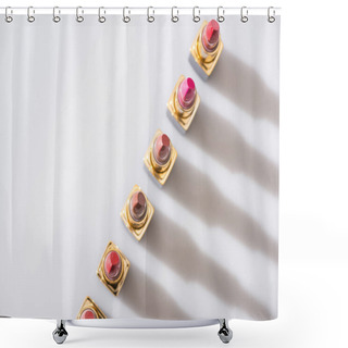 Personality  Top View Of Assorted Lipsticks In Luxury Tubes In Line On White Background Shower Curtains