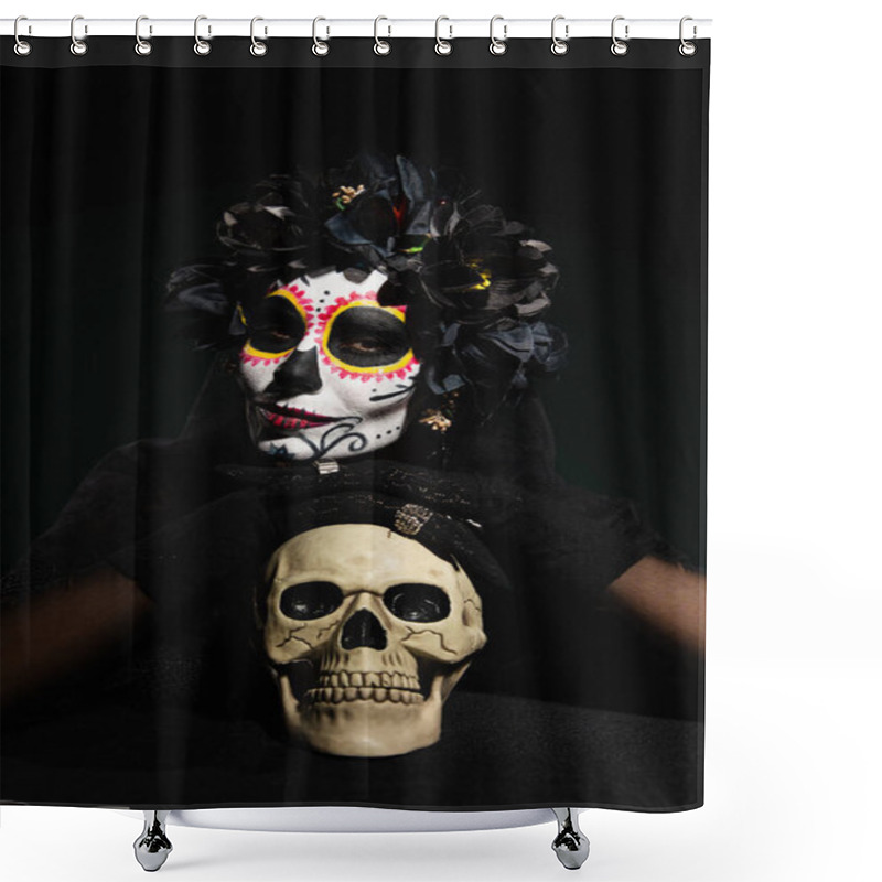 Personality  Woman in mexican day of death costume looking at camera near skull isolated on black  shower curtains