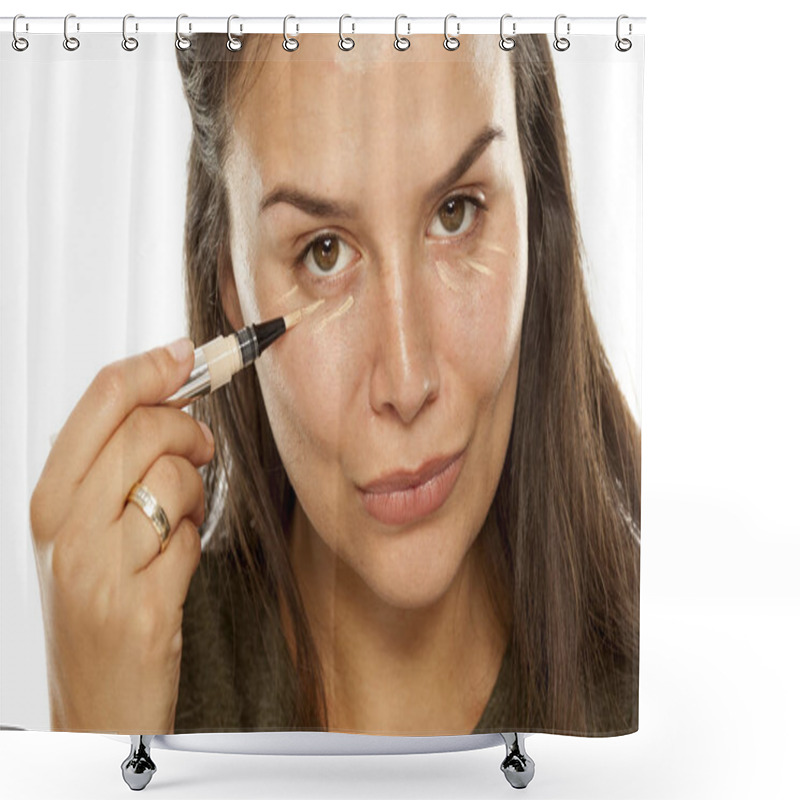 Personality  Young Woman Applying Concealer Under Her Eyes On A White Background Shower Curtains