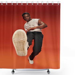 Personality  Stylish African American Man In Daring Pose With Outstretched Leg On Red And Orange Backdrop Shower Curtains