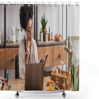Personality  Smiling African American Craftswoman Looking In Notebook And Talking On Smartphone Near Laptop And Handmade Products, Banner Shower Curtains