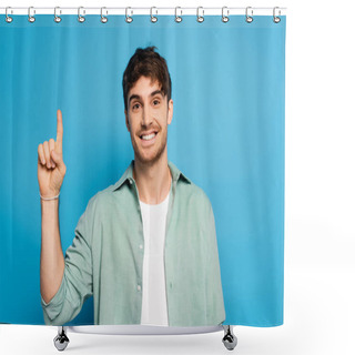 Personality  Happy Man Looking At Camera While Showing Idea Gesture On Blue Shower Curtains